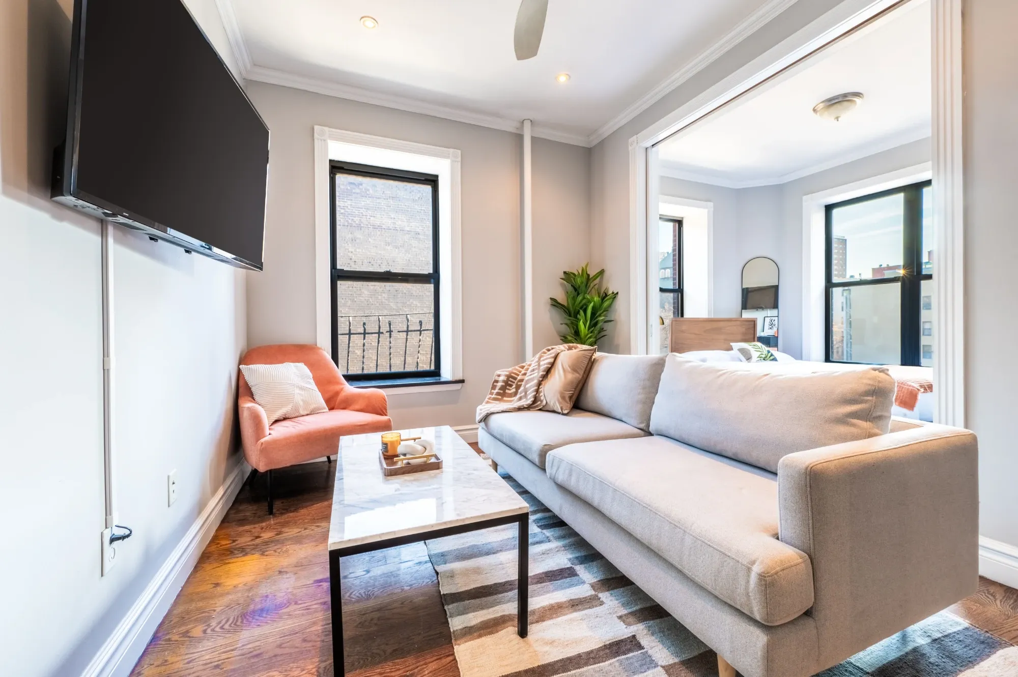 A furnished living room in a Roomrs apartment